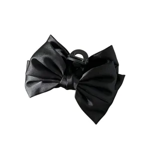 Elegante grote zwarte satijnen strik haarklem voor dames, stijlvolle haaraccessoire.