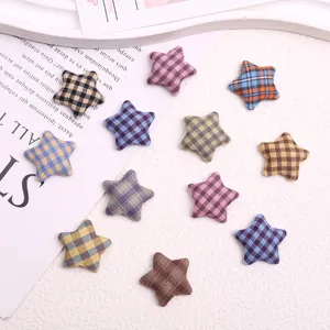 Plaid fabric star buttons detail shot, vintage DIY clothing accessories and coat decorative patches.