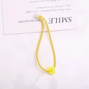 Elastico per capelli giallo con perla bianca e anello giallo per acconciature quotidiane bambini.