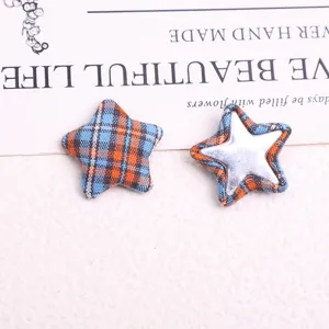 Detailed view of retro plaid star fabric buttons and DIY patches for coats and clothing decor.