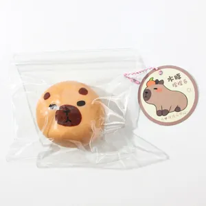Cute capybara squishy toy detail view, soft stress relief toy in bag with cute paper tag.