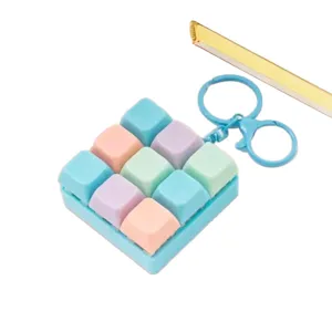 Porte-clés fidget jouet anti-stress interrupteur mécanique 9 touches macaron coloré.