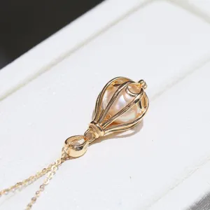 Exquis pendentif perle lanterne creuse en argent sterling S925 vue de détail gros plan.