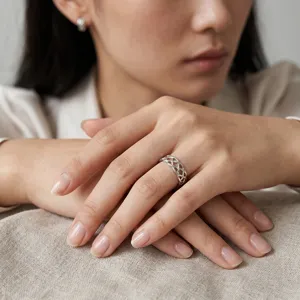 Elegant silver Celtic weave knot ring for women, stylish hollow braided finger jewelry.