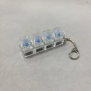 Transparent 4-key mechanical keyboard switch keychain stress relief toy with soft light.