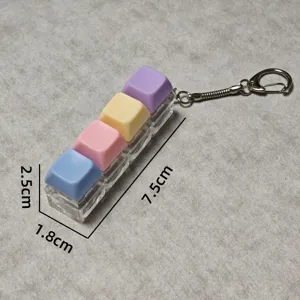 Macaron 4-key mechanical keyboard switch fidget toy keychain with LED lights and clear base.