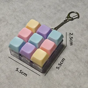 Macaron color mechanical keyboard keycap fidget toy keychain, compact stress relief gadget.