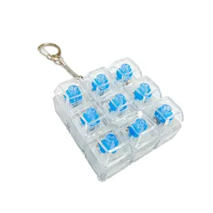 Transparent 9-key mechanical switch fidget toy keychain, clear keycaps blue switch.