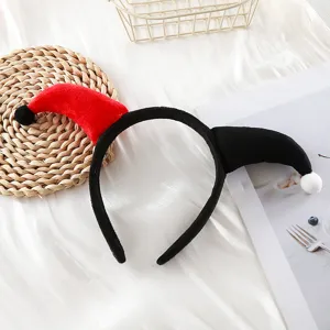 Close-up detail of the black and red plush clown horn headband, perfect for Halloween.