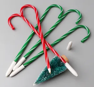 Christmas candy cane shaped ballpoint pens novelty festive pens with caps and mini tree.