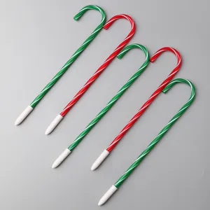 Christmas candy cane shaped ballpoint pens set, cute plastic festive stationery with white tips.