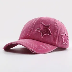 Women's pink washed distressed baseball cap with sparkly glitter star patches for casual daily wear