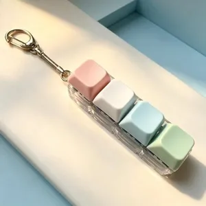 4-key mechanical keyboard fidget toy keychain, colorful stress relief clicker with clear base.
