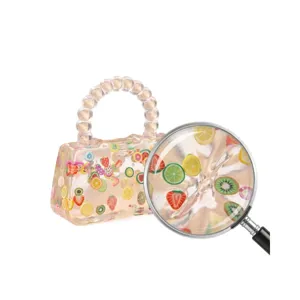 Bolsito transparente de juguete antiestrés con frutas de colores y asa de cuentas para niños.