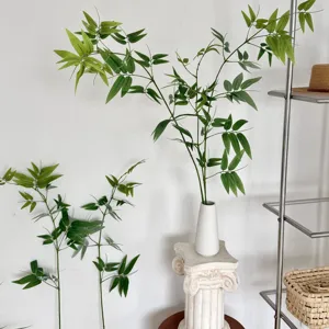 Detail view of artificial green bamboo branch for interior zen tea room decoration and styling.