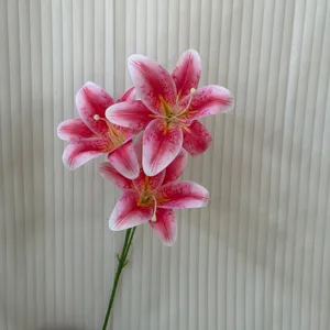 Detailed close-up view of artificial pink lily flower bouquet stem, realistic home decor.