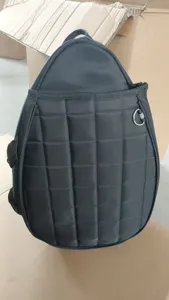 Close-up detail of the black quilted racket bag showcasing durable fabric and sturdy stitching.