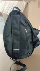 Black single strap sports racket backpack, durable fabric, zipper pocket, mesh side pocket.