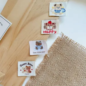 Cute cartoon woven labels embroidered cloth patches for DIY doll clothes sewing accessories.