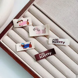 Cute cartoon puppy embroidered cloth labels and letter woven tags for DIY clothing decoration.