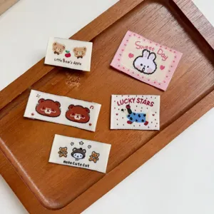 Cute embroidered fabric labels, cartoon bear and animal patches for DIY hair clips, bags and socks.