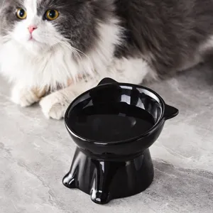 Gamelle pour chat en céramique noire surélevée avec design incliné, mangeoire pour animaux.