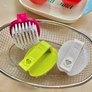 Multipurpose fruit vegetable cleaning brush with cute apple heart shape design for kitchen use.