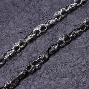 Punk rock metal skull chain detail shot, stylish jeans pants chain and waist accessory for men.