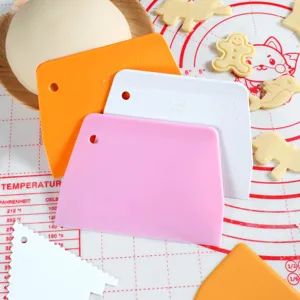 Plastic bench scraper dough cutter baking tool for cake cream smoothing and kitchen pastry dough.
