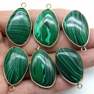 Teardrop green malachite pendant with gold rim, elegant DIY jewelry making accessory detail.