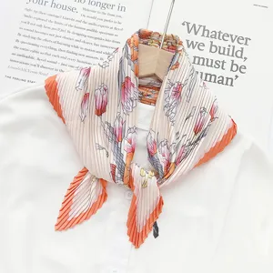 Pleated floral scarf with vibrant orange border, elegant women neckerchief detail shot