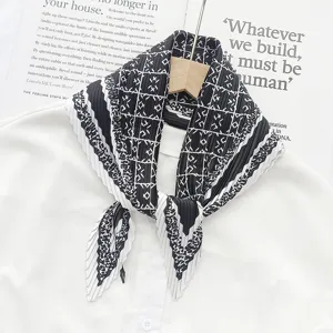 Detailed view of a stylish black and white pleated geometric print women fashion scarf.