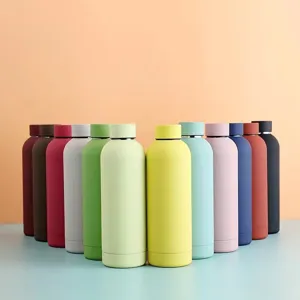 Detailed shot of colorful insulated water bottles, matte finish, perfect for outdoor sports.