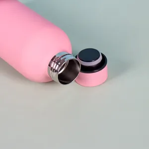 Pink insulated stainless steel water bottle detail view, portable vacuum flask for outdoor travel.