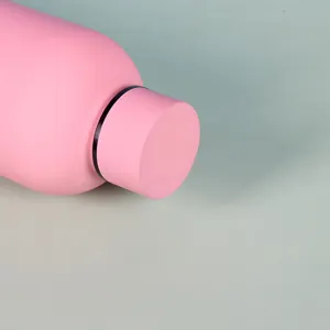 Close-up detail of the pink insulated stainless steel water bottle cap and neck design.