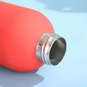 Stainless steel insulated water bottle detail close up, red matte finish portable sports flask.