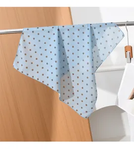 Light blue polka dot square scarf, elegant retro design, ideal for neck or hair styling.