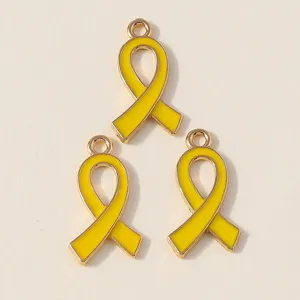 Yellow enamel ribbon charms detail, gold-tone metal alloy DIY pendant for jewelry making.