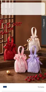 Detail view of fabric wedding favor gift bag with elegant ribbon handle and jacquard texture.