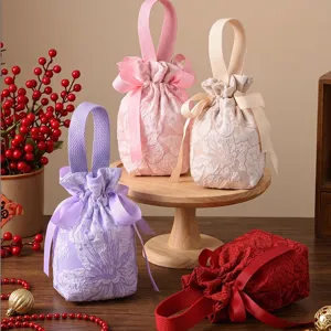 Fabric wedding candy favor bags with bows and handles, elegant jacquard gift storage pouch.