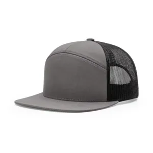 Grey 7-panel blank trucker hat with black mesh back and flat brim for custom embroidery.