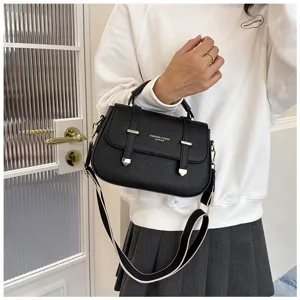 Detailed view of the vintage black leather shoulder bag with stylish double strap design.