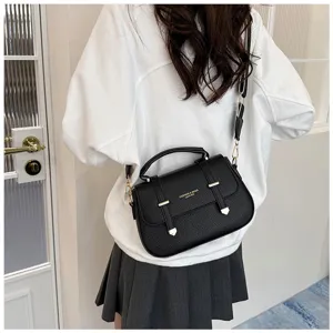 Black textured leather crossbody shoulder bag for women with top handle and double straps.