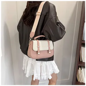 Detail view of the retro colorblock saddle bag with wide strap and double belt accent.