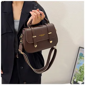 Retro brown leather saddle bag for women, stylish double strap shoulder crossbody handbag.