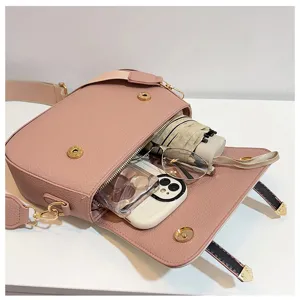 Pink leather vintage saddle bag with large capacity, double strap design, ideal for daily use.