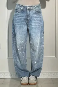 Sparkle rhinestone denim jeans detail view, featuring trendy glitter crystals and wide leg fit.
