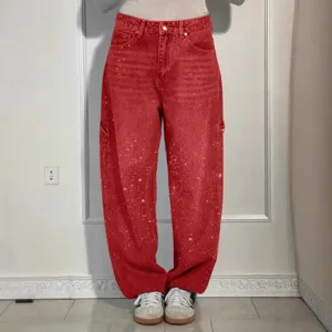 Women red rhinestone splatter denim jeans casual loose straight pants for daily wear.