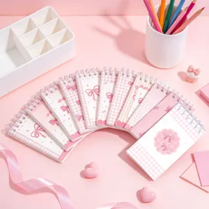 Pink bow spiral notebook detail view, cute aesthetic pocket memo book for students.
