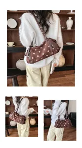 Korean style polka dot underarm shoulder bag for women, trendy niche casual handbag with strap.
